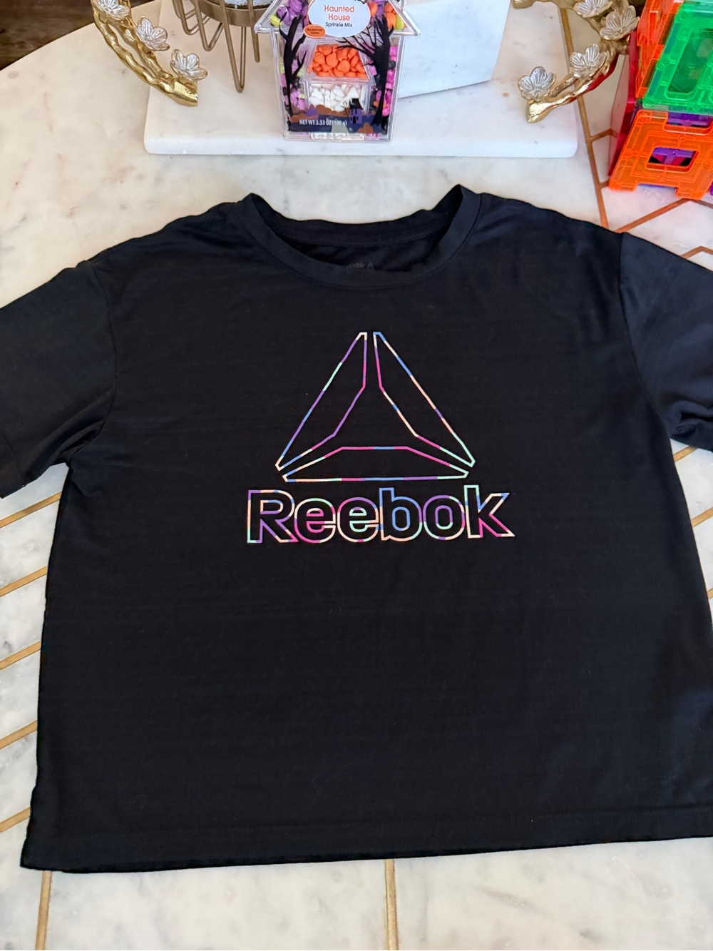 Reebok Black Tee with Multicolor Iridescent Logo